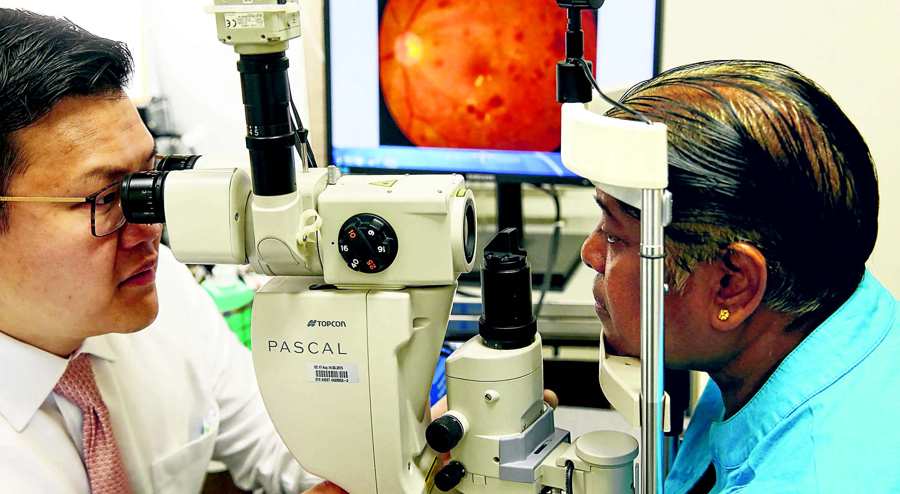  demonstrating how laser treatment can be used for a patient’s diabetic eye disease. ST PHOTO SEAH KWANG PENG